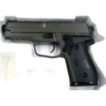 New old stock airsoft pistol, model V12 in brown, boxed. P&P Group 2 (£18+VAT for the first lot