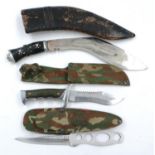 Modern hunting knife in a camouflage sheath, with a throwing knife by Survival Boy and another (