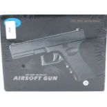 New old stock airsoft pistol, model V20 in brown, boxed and unopened. P&P Group 2 (£18+VAT for the