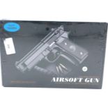New old stock airsoft pistol, model V22 in black, boxed and unopened. P&P Group 2 (£18+VAT for the