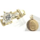 14ct gold solitaire ring, size V/W, and a 14ct gold miniature religious pendant, D: 11 mm,