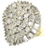 18ct gold baguette and round cut diamond set ring, size O, 9.7g. P&P Group 1 (£14+VAT for the