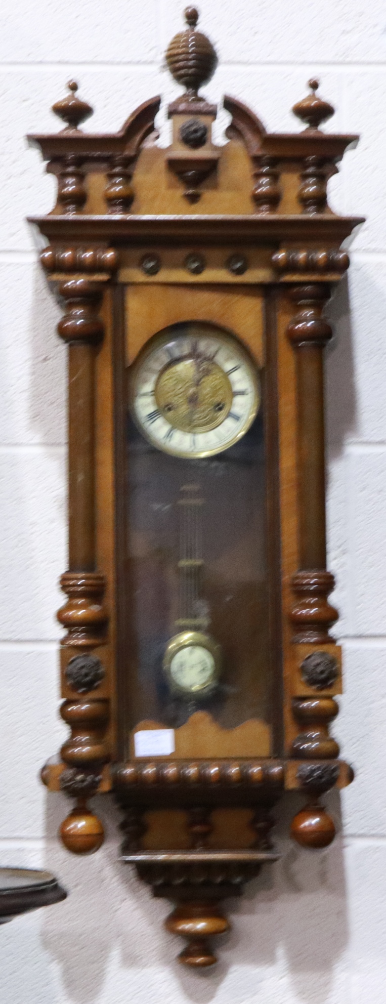19th century walnut cased Vienna wall clock with pendulum display door, H: 105 cm. Not available for