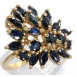 9ct gold dress ring set with a cluster of sapphires, size P, 3.4g. P&P Group 1 (£14+VAT for the