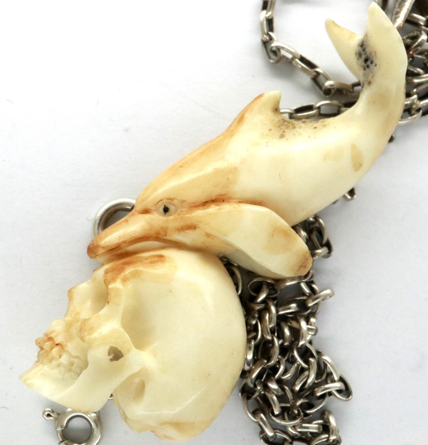 Meerschaum skull and dolphin form pendant, on a 925 silver neck chain, L: 50 cm. P&P Group 1 (£14+ - Image 4 of 4