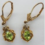 Pair of 10ct gold diamond and emerald drop earrings, drop H: 30 mm, combined 1.8g. P&P Group 1 (£