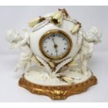 Moore & Co ceramic cherub surround mantle clock, working at lotting, H: 22 cm. P&P Group 3 (£25+