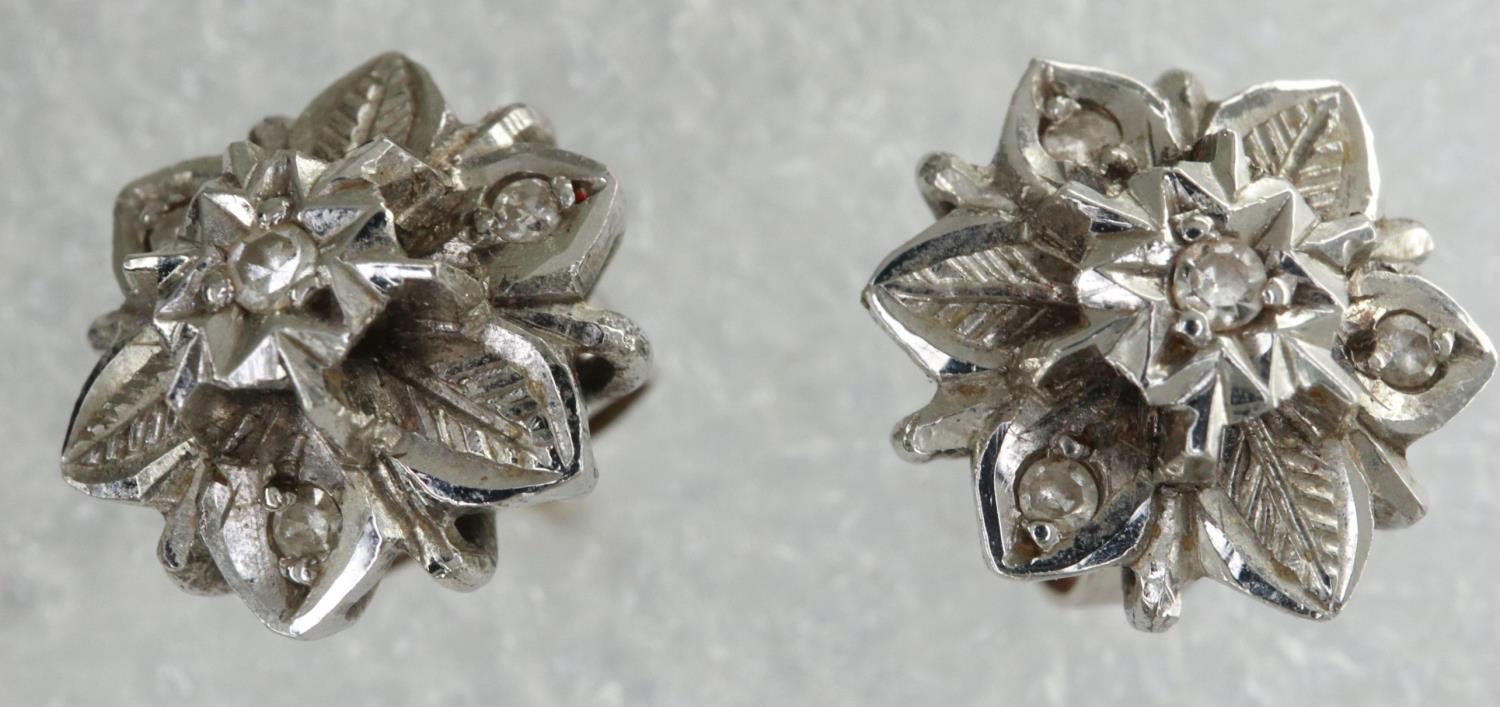 Pair of 18ct white gold diamond set flower stud earrings, 2.9g. P&P Group 1 (£14+VAT for the first