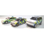 Three Scalextric police cars in good condition, missing two mirrors, unboxed. P&P Group 1 (£14+VAT