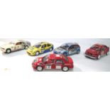 Five Slot cars comprising of Auto Art 4 wheel drive Mitsubishi and four Scalextric, mostly in very