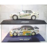 Two Scalextric rally cars to include Mitsubishi and Opel Vectra both in very good to excellent