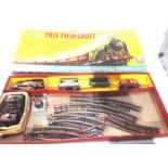 Trix Twin Cadet train set comprising 0.4.0 tank loco, plastic body, three tinplate wagons, three