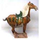 Chinese Tang Style horse with a sancai glaze, H: 38 cm, tail of horse has had restoration, otherwise