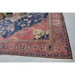 Very large red ground rug with polychrome geometric design, 500 x 440 cm. Not available for in-house
