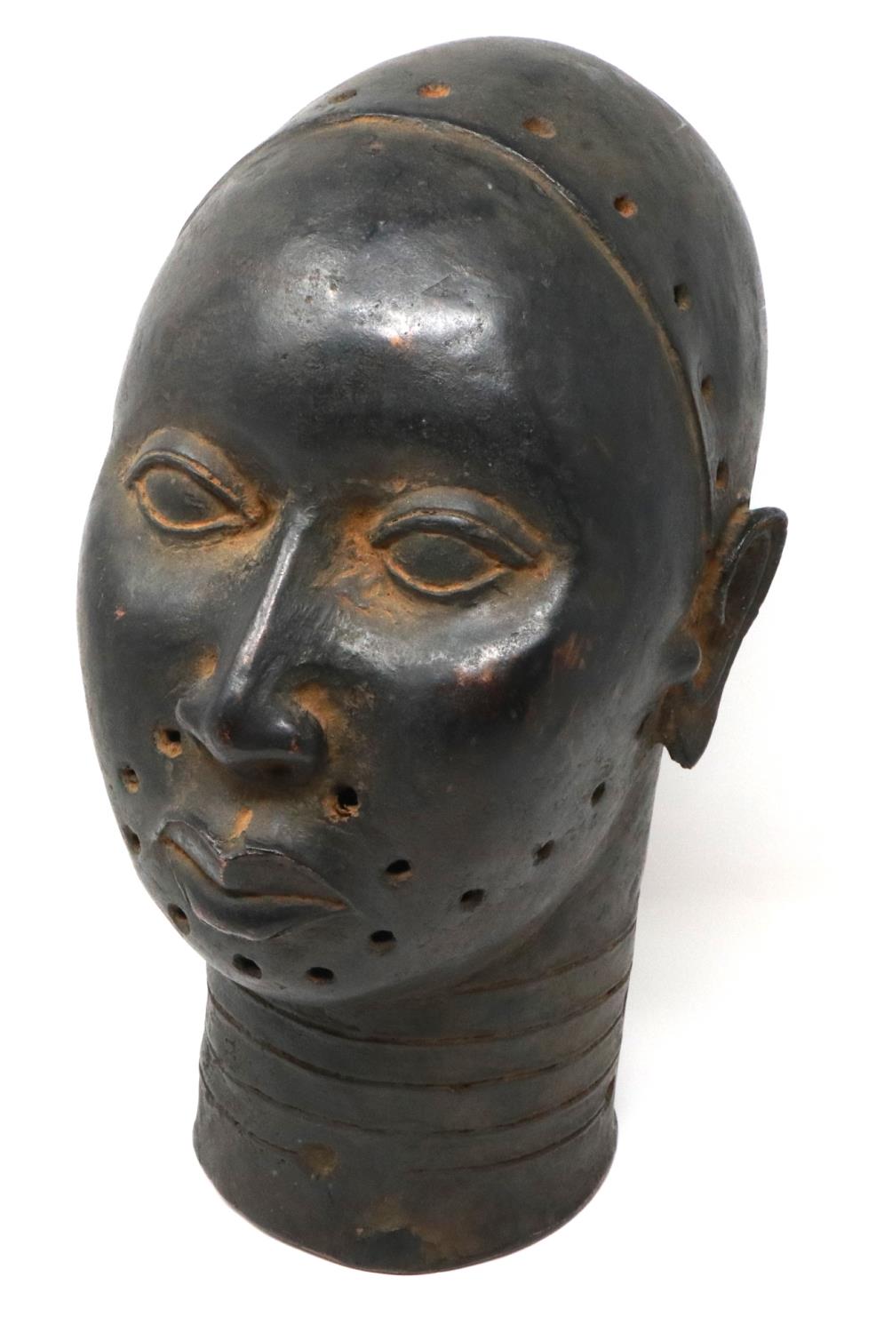 Cast metal life-size bust of a Tribal warrior with pierced decoration, H: 38 cm. P&P Group 3 (£25+