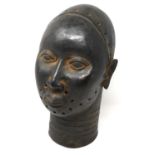 Cast metal life-size bust of a Tribal warrior with pierced decoration, H: 38 cm. P&P Group 3 (£25+