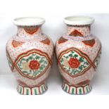 Pair of 19th century Chinese vases, each H: 40 cm, with polychrome decoration, slight wear to