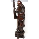 Carved hardwood statue of Shou Lao (Shou Xing) Taoist God of Longevity, standing on a bat, H: 60 cm.