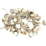 Hallmarked silver charm bracelet with 925 silver charms and padlock clasp, L: 18 cm, combined 93g.