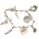 925 silver charm bracelet with eight charms, L: 18 cm. P&P Group 1 (£14+VAT for the first lot and £