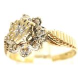 9ct gold daisy ring set with diamonds, size K, 1.8g. P&P Group 1 (£14+VAT for the first lot and £1+