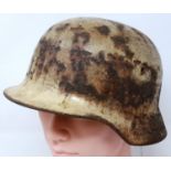 WWII German M35 helmet with remaining winter camouflage paint. P&P Group 2 (£18+VAT for the first