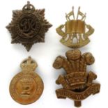 Four WWII cap badges. P&P Group 1 (£14+VAT for the first lot and £1+VAT for subsequent lots)