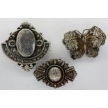Three silver brooches including a hallmarked silver example, largest L: 40 mm. P&P Group 1 (£14+