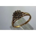 9ct gold diamond cluster ring, size O, 1.8g. P&P Group 1 (£14+VAT for the first lot and £1+VAT for