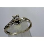 9ct gold diamond solitaire ring with diamond set shoulders, size N, 1.8g. P&P Group 1 (£14+VAT for