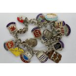 925 silver charm bracelet with eighteen enamelled charms, L: 20 cm. P&P Group 1 (£14+VAT for the