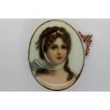 Hand painted miniature portrait brooch of a young lady set in 9ct gold frame with safety chain, H: