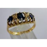 18ct gold diamond and sapphire set ring, size R, 3.3g. P&P Group 1 (£14+VAT for the first lot and £