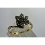 9ct gold flower head ring set with seven cubic zirconia, size J/K, 1.9g. P&P Group 1 (£14+VAT for