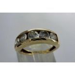 9ct gold channel set ring with five cubic zirconia, size J, 3.5g. P&P Group 1 (£14+VAT for the first