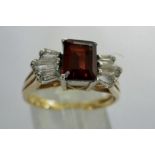 9ct Art Deco style trilogy ring set with garnet and cubic zirconia, size Q, 3.1g. P&P Group 1 (£14+