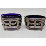 Two continental silver open salts with blue glass liners, L: 70 mm, 59g. P&P Group 1 (£14+VAT for