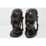 Pair of African carved native heads, H: 24 cm. P&P Group 3 (£25+VAT for the first lot and £5+VAT for