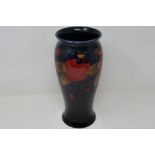 Large Moorcroft vase in the Pomegranate pattern against a blue ground, signed to base, H: 27 cm,