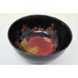 Moorcroft footed bowl in the Pomegranate pattern, signed to base, D: 13 cm, crazing throughout,