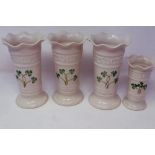 Four Belleek vases, all with fluted rims, largest H: 15 cm, no cracks or chips. P&P Group 2 (£18+VAT