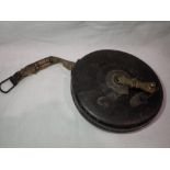 James Bodington & Son leather cased tape measure, measures in feet and inches with every foot marked