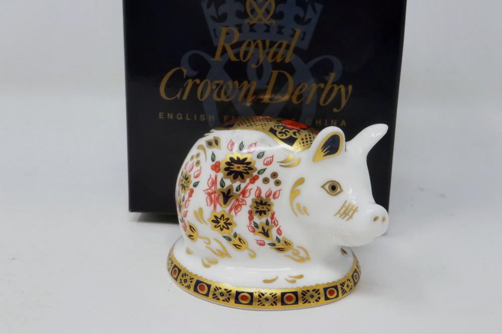 Royal Crown Derby boxed piglet paperweight, with gold stopper, H: 50 mm, no cracks or chips. P&P