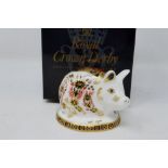 Royal Crown Derby boxed piglet paperweight, with gold stopper, H: 50 mm, no cracks or chips. P&P