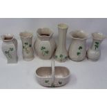 Seven pieces of Belleek, mostly stem vases, largest H: 13 cm, no cracks or chips. P&P Group 3 (£25+