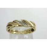 9ct gold diamond set crossover ring, size M, 2.3g. P&P Group 1 (£14+VAT for the first lot and £1+VAT