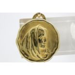 18ct gold (unmarked) Catholic pendant, wave edge with a depiction in relief of Mary, c.1930s, D: