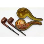 Two briar pipes and a heavily carved cased meerschaum example. P&P Group 1 (£14+VAT for the first