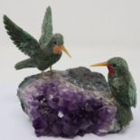 Two hummingbirds on an amethyst geode. P&P Group 1 (£14+VAT for the first lot and £1+VAT for