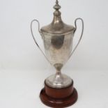 Hallmarked silver trophy with cover and wooden stand, presented to Yarwoods bowling club by S J